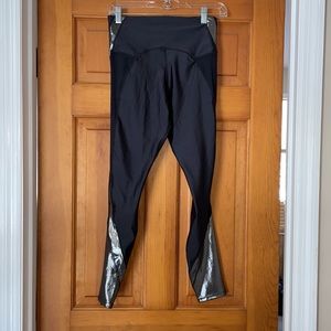 Nike dry-fit leggings. Metallic detailing on side. Perfect condition! NWOT